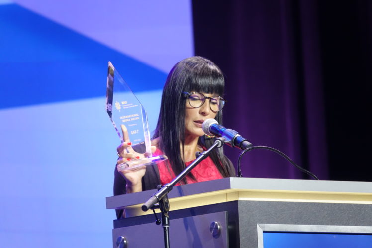 SAT-7 CEO Rita El-Mounayer holds up the International Media Award