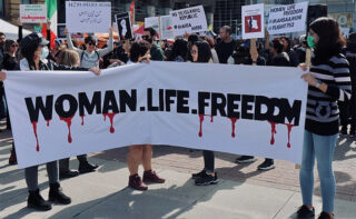 Woman life freedom sign at protest