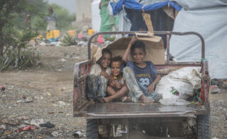 Yemeni kids sitting in back of car