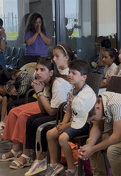 Kids praying at camp
